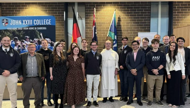 A large group photo of students with Fr Laurie Foote OP at John XXIII College