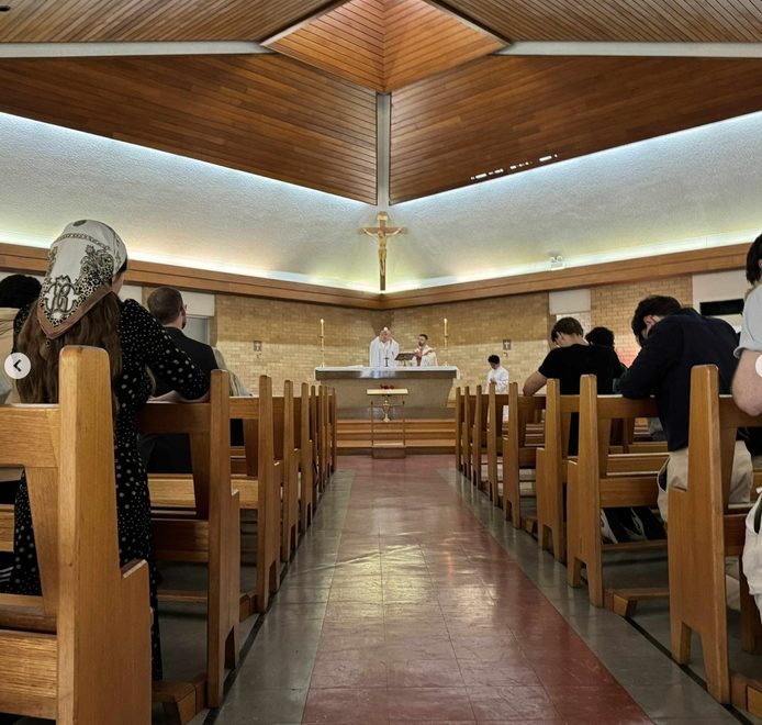 Students at the Society's weekly Mass in the chapel
